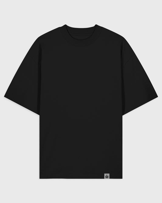 Flatlay Vorderansicht – Stanley/Stella Blaster 2 Oversized T-Shirt in Schwarz – cleanes Frontdesign – Oversized Fit Unisex Shirt aus Bio-Baumwolle.
