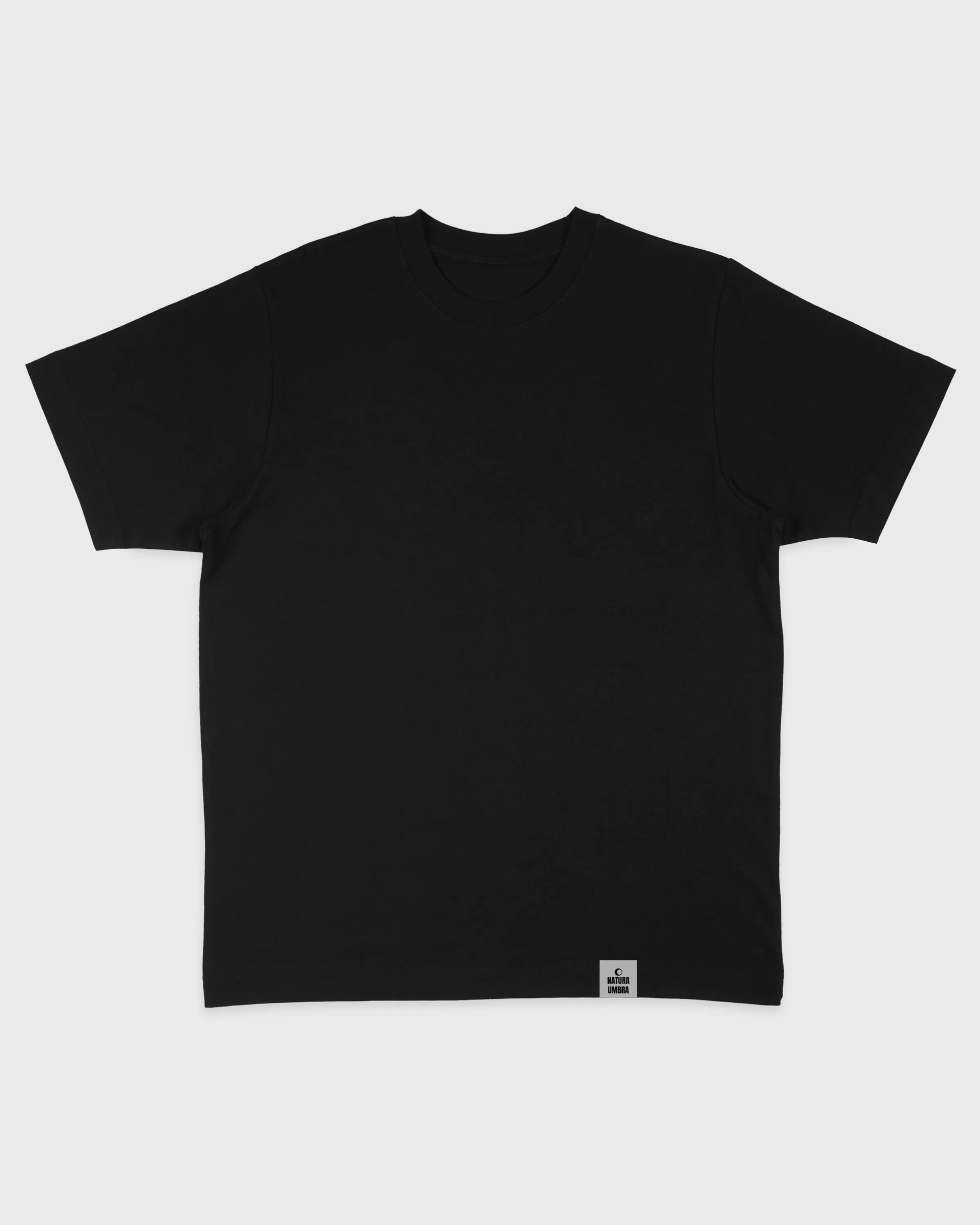 Flatlay-Ansicht des Stanley/Stella Freestyler Oversized Unisex T-Shirts in Schwarz – schweres Bio-Baumwollshirt mit modernem Relaxed Fit und nachhaltiger Produktion.