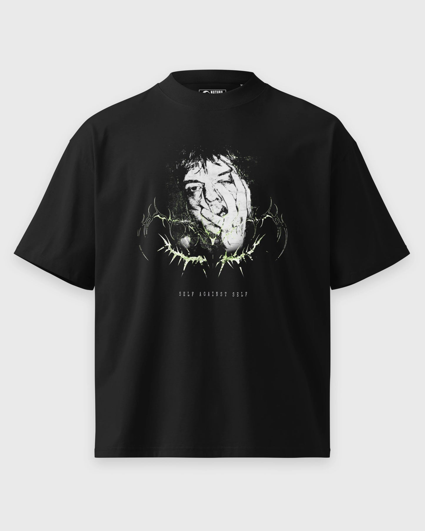Schwarzes oversized T-Shirt mit SELF AGAINST SELF Frontmotiv in der Vorderansicht.